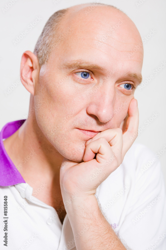 Portrait of the bald man. Thinking about something.