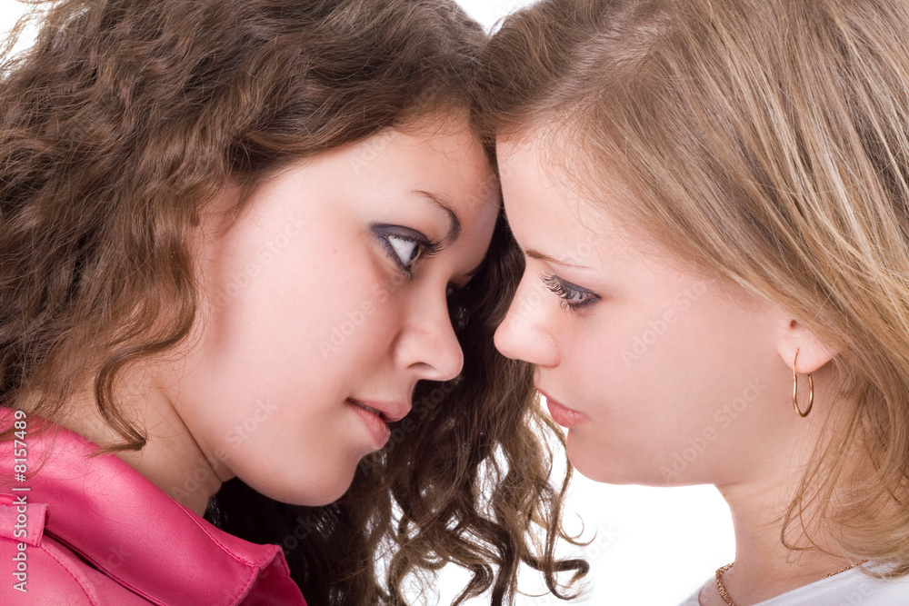 Portrait of the two beauty young women. Isolated. Portrait of the two beauty young women. Isolated.