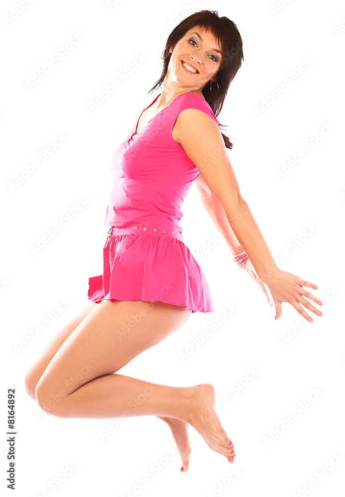 Girl jumping of joy over white background Girl jumping of joy over white background