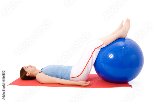Young woman performing fitness exercises