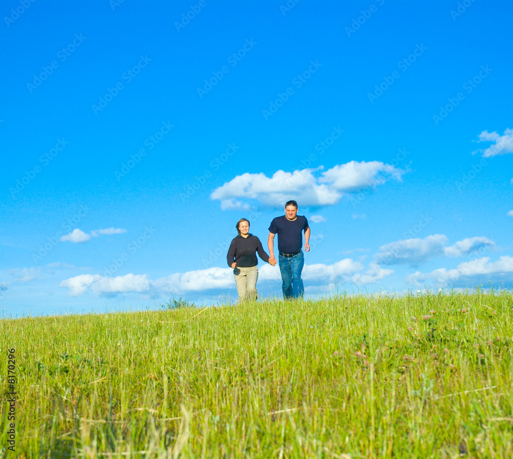 people running to a meadow people running to a meadow
