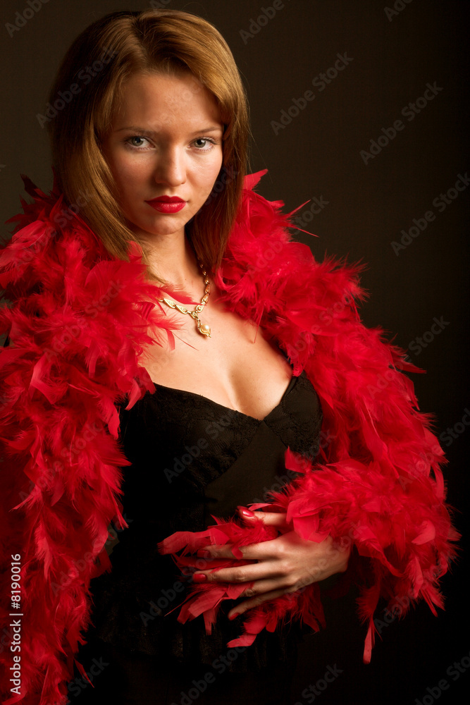 Young glamour woman in red boa Young glamour woman in red boa