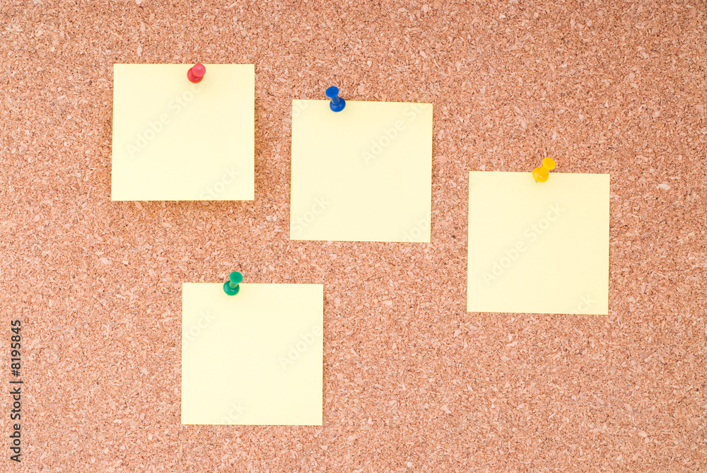 Yellow Note Papers With Tacks On Cork Surface Yellow Note Papers With Tacks On Cork Surface