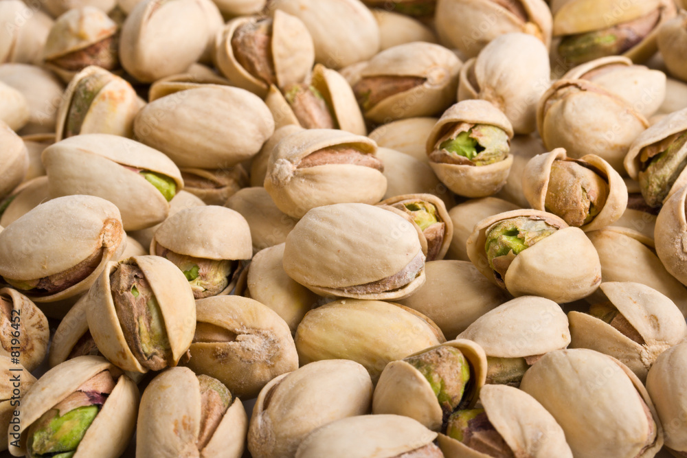 Pile of pistachio nuts close up