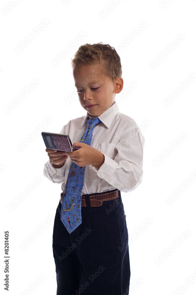 Young boy dressed as businessman sends SMS text message - isolat Young boy dressed as businessman sends SMS text message - isolat