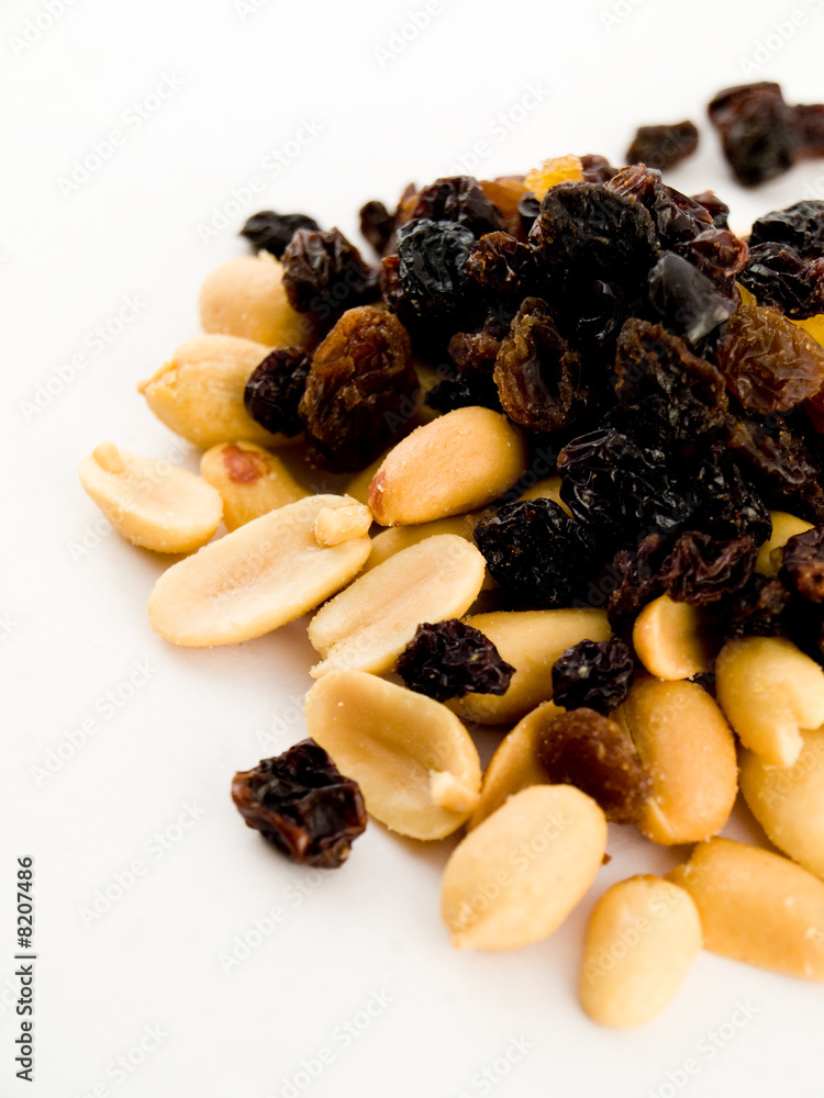Stack Pile of Peanuts and Raisins on White Background Stack Pile of Peanuts and Raisins on White Background