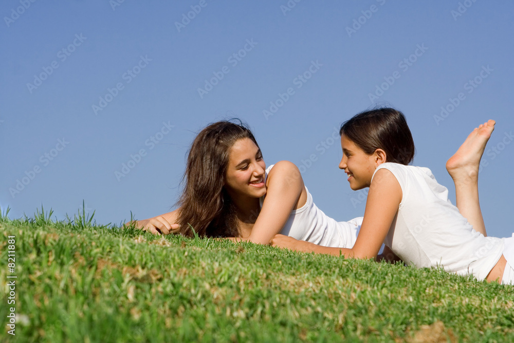 teenagers friends relaxing talking outdoors in summer teenagers friends relaxing talking outdoors in summer