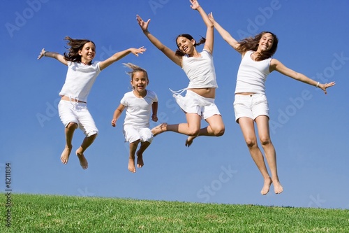 happy group of youth, children or kids jumping with joy