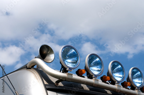 spot-lamps of the truck on the sky background photo