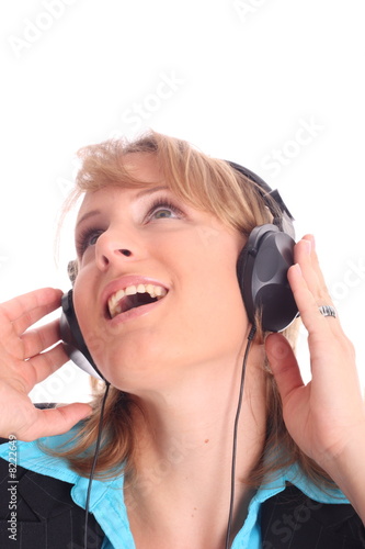 Pretty woman listening to music with headphone