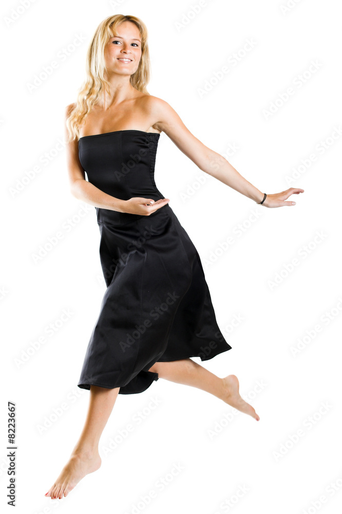 Naklejka premium jumping woman wearing a dress on white background