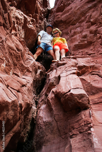 Couple climbing in red rocks