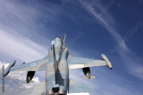 Tablou canvas Fighter jet in sky background