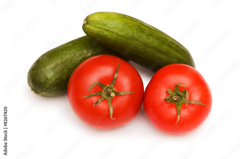 Tomatoes and cucumbers isolated on the white Tomatoes and cucumbers isolated on the white