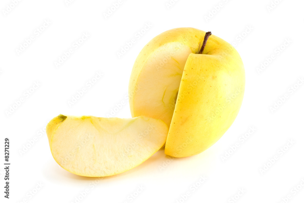 Yellow apple with piece cut