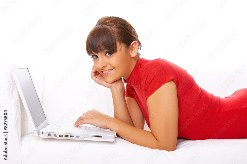 Girl with laptop on couch Girl with laptop on couch