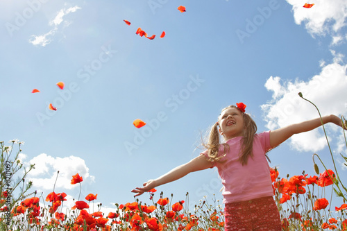 Little girl in poppy field