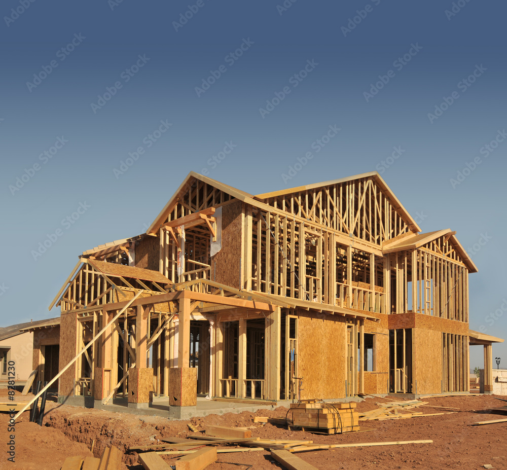 A new home being built with wood, trusses and supports