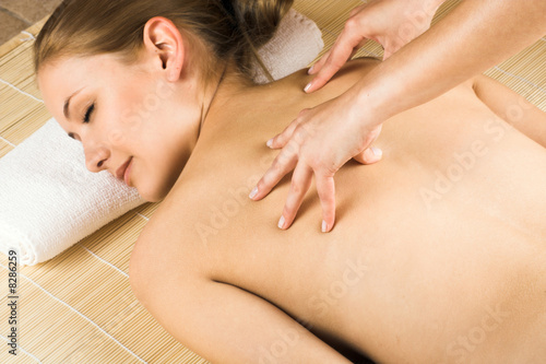 beauty portrait of a young woman getting a massage