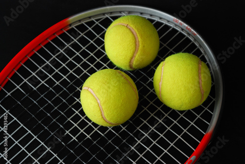 tennis racket and three balls © Marian D