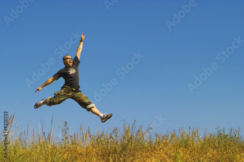 man jumping on a meadow