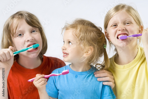 Children brushing teeth