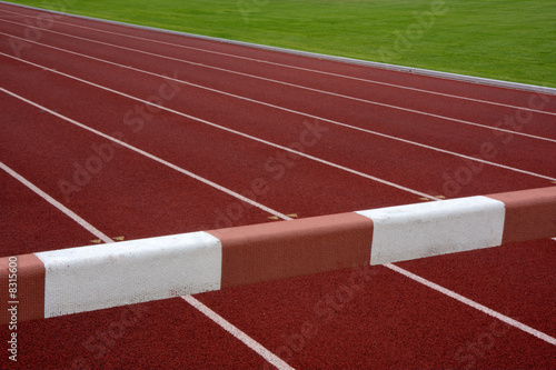 steeplechase barrier across running tracks photo