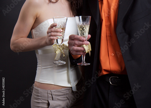 man and woman hold in hands glasses with a champagne
