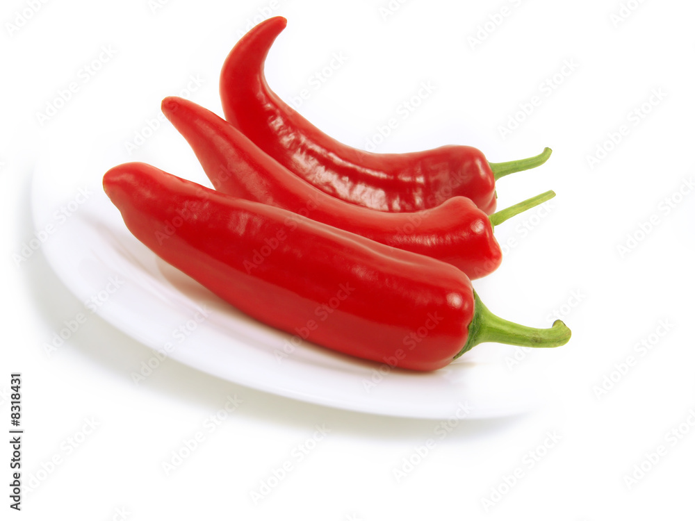 Tasty red peppers on white plate