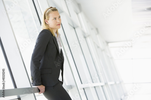 Businesswoman standing in corridor