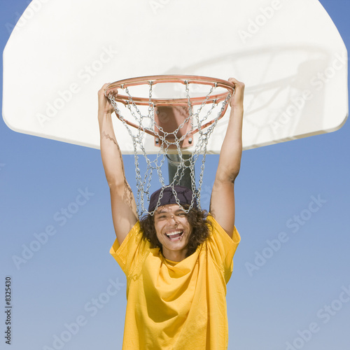 Teen biy hangs from hoop