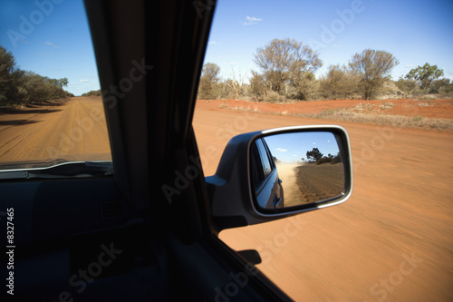 Vehicle on dirt road