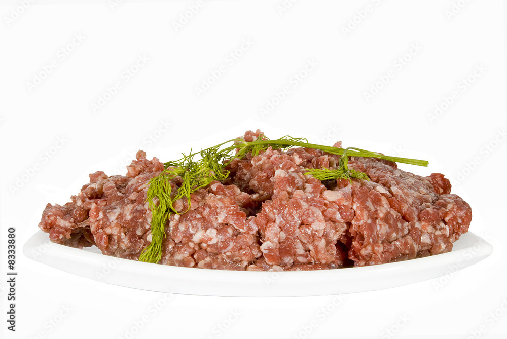 The beef forcemeat on a white background The beef forcemeat on a white background