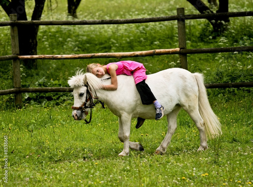 Little girl with a pony