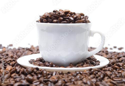 The cup full of coffee beans  