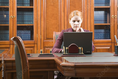 Business woman in classic wood working place photo