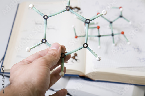 Hand holding molecular model