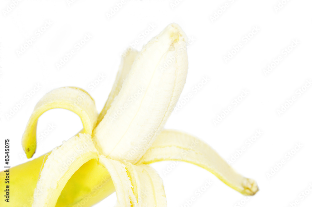 A single peeled fresh banana isolated on white background A single peeled fresh banana isolated on white background