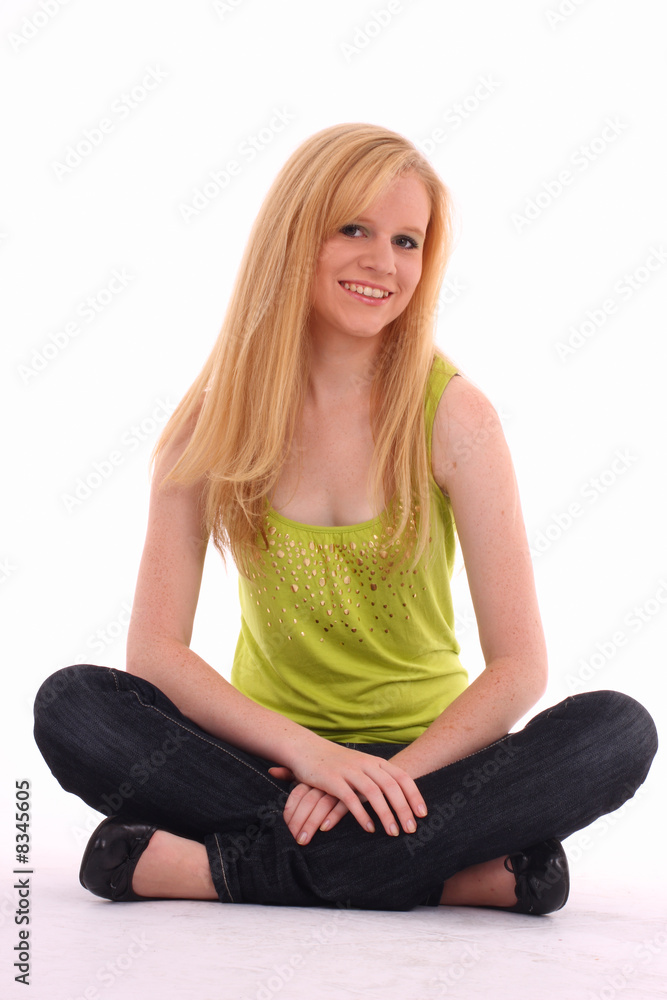 Pretty girl - teenager sitting on floor