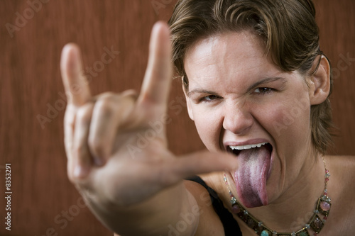Pretty Woman Making Bull Horns