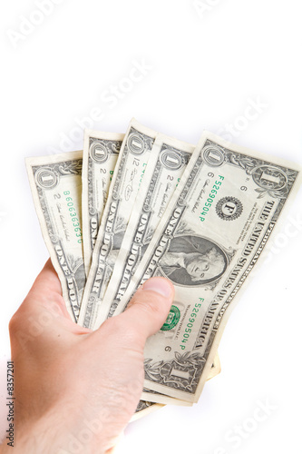 dollars in a hand isolated on white