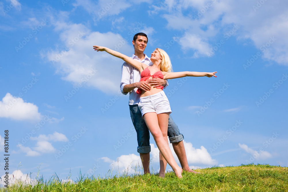 Young love couple having fun on spring meadow Young love couple having fun on spring meadow