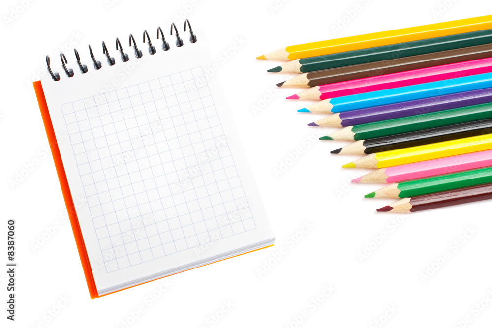 Blank notebook and coloured pencils Blank notebook and coloured pencils