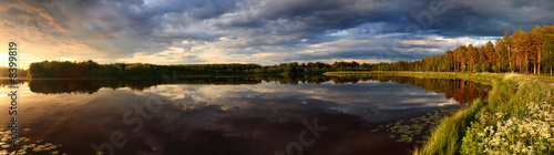 Lake at sunset panorama