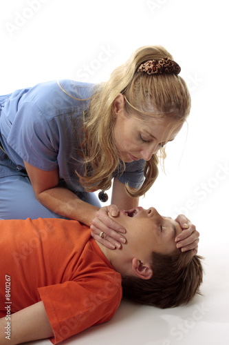 Nurse preparing child for resuscitation