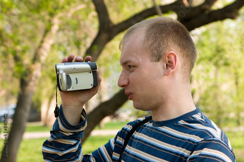 The man with a videocamera. photo