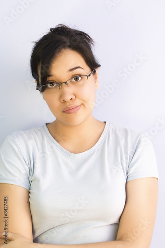Woman wearing glasses, making a face