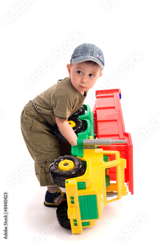 Little boys play with toy truck