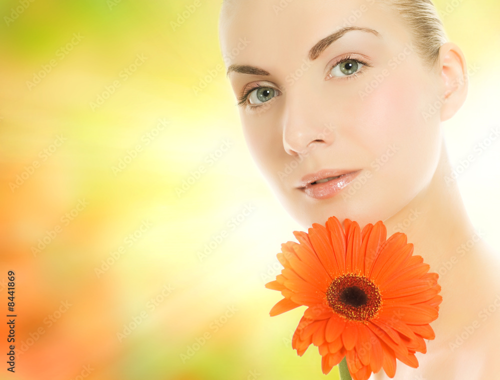 Beautiful young woman with gerbera flower Beautiful young woman with gerbera flower