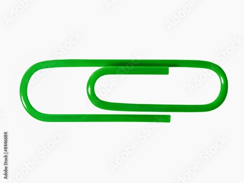Green paper clip isolated